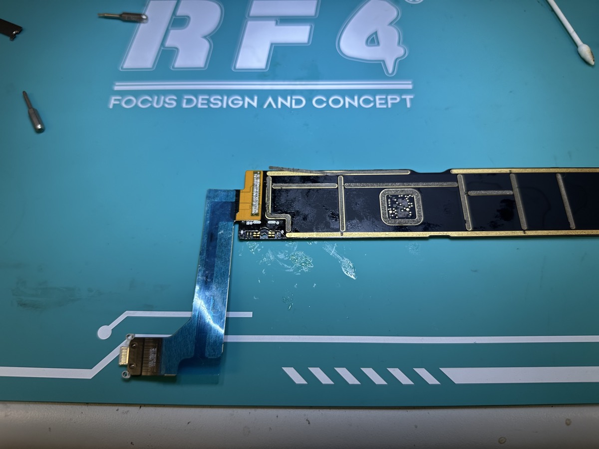 New premium charge port soldered onto an iPad 10th Generation logic board